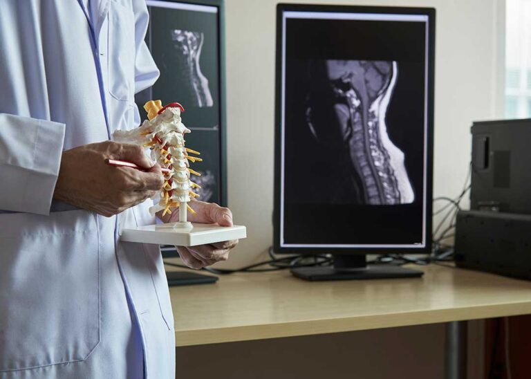 A person gently stretching their neck at home with a calm, attentive expression.